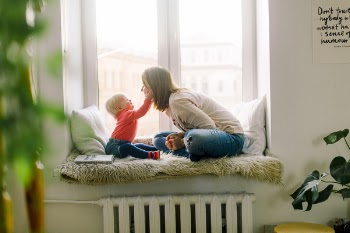 Baby Touching Woman's Face