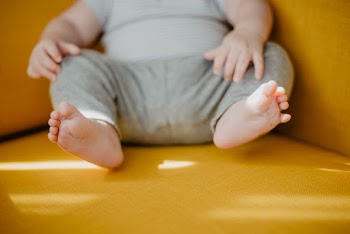 Baby Wearing Grey Shirt And Pants