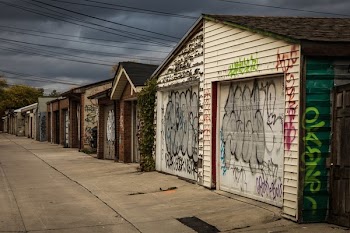 Back Alley Grafitti On Garage Doors