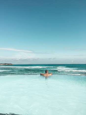 Back View of Man in Swimming Pool