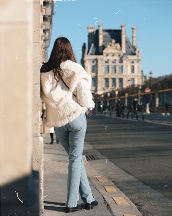 Back View of Woman Leaning Against Wall · Free Stock Photo