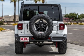 Back View Photo of a Parked White Jeep Wrangler Rubicon
