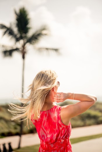 Back View Photo of Woman in Red Sleeveless Top