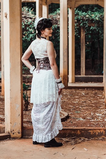 Back View Photo of Woman in White Sleeveless Lace Dress Posing