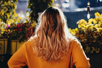 Back view Photo of Woman Wearing Yellow Sweater