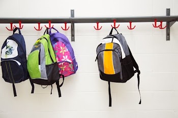 Backpacks Hanging On Hooks