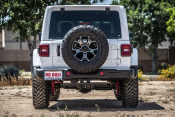 Backview photo of a parked white jeep wrangler