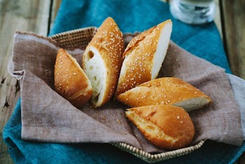 Baked Breads on Gray Textile