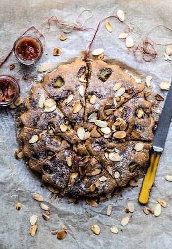 baked cake next to knife and dip sauces
