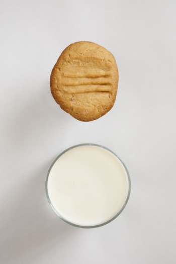 Baked Cookie Near White Liquid in Cup
