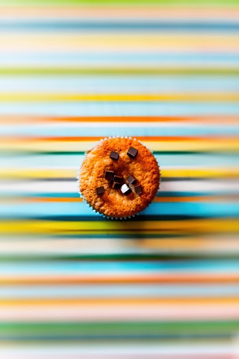 Baked Cupcake With Bits of Chocolate Cubes on Top