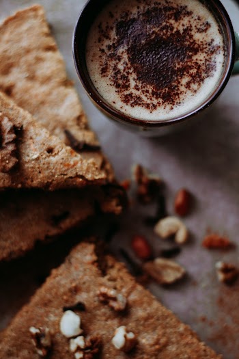 Baked Pastry Beside Ceramic Mug
