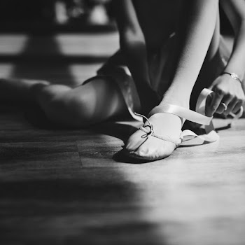 Ballerina Putting Her Shoes