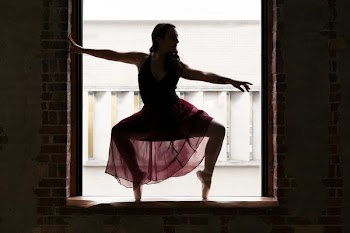 Ballet Dancer On Pointe In Window