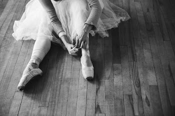 Ballet Dancer Ties Ballet Slippers