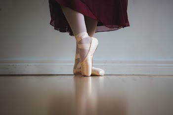 Ballet In Red Skirt With Toe Shoes