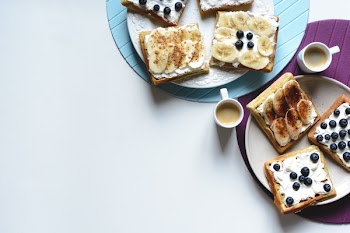 Banana and bluberries waffles with coffee espresso 