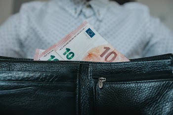 Banknotes in Black Leather Wallet Closeup Phoot