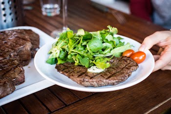 Barbequed beef steak with greens 