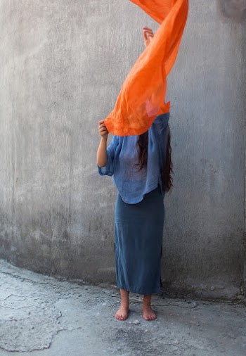 Barefooted Woman Wearing Blue Long-sleeved Blouse 