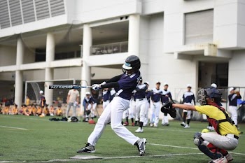 baseball players playing baseball on baseball field