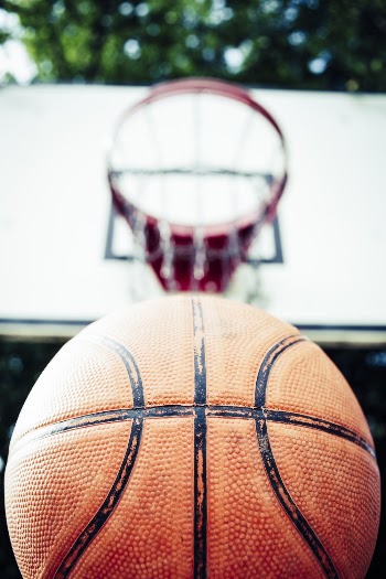 Basketball Near Basketball Hoop
