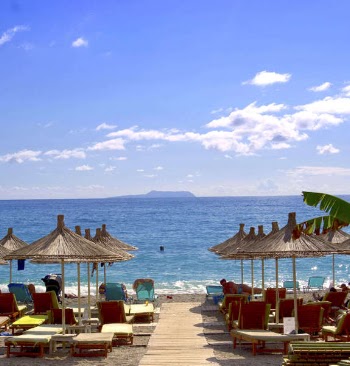 Beach and Hut during Daytime