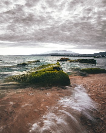 Beach Line Under Gray Clouds