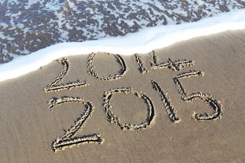 beach shore etch with 2014 and 2015 texts during daytime