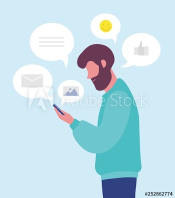 Bearded man chatting online or texting on smartphone or mobile phone