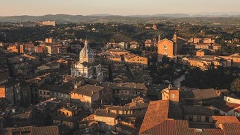 Beautiful aerial view by a drone of Siena, Italy. Charming old buildings showcase western Europe's architecture.