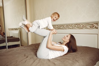 Beautiful family spend time in a bathroom Free Photo