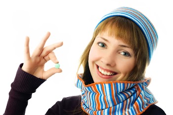 beautiful happy girl holding a tablet in her hand isolated against white background