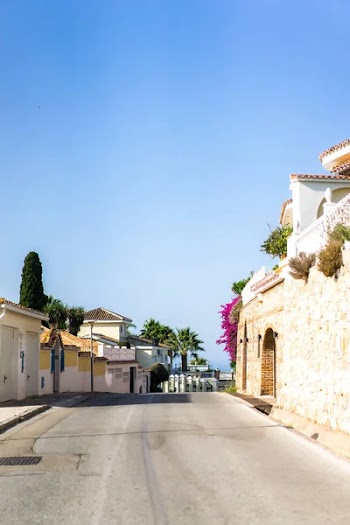 Beautiful landscape of a small spanish town for summer holidays. Mountains and white houses on the coast.