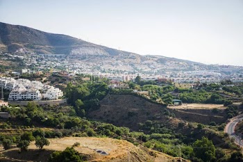 Beautiful landscape of a small spanish town for summer holidays. Mountains and white houses on the coast.