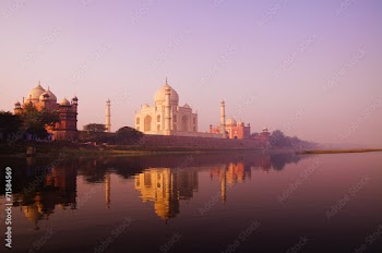 Beautiful Scenery Of Taj Mahal And A Body Of Water