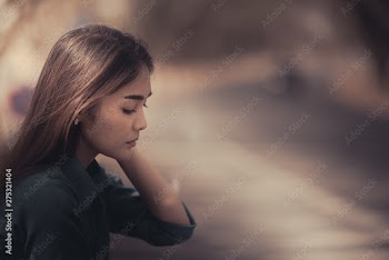 Beautiful thai woman very sad from unrequited love,rethink,think over,vintage style,dark tone,broken heart,asian girl