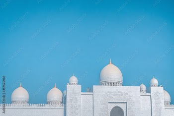 Beautiful white mosque against the blue sky