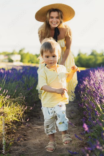 Beautiful woman and her cute little son in the lavender field