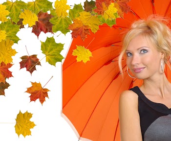 Beautiful woman with orange umbrella over abstract autumn background