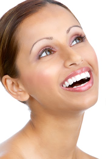 Beautiful young smiling woman. Isolated over white  background