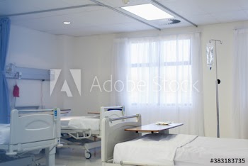 Beds in empty hospital room
