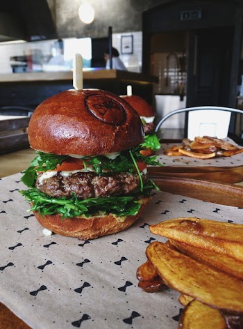 Beef burger with homemade baked potatoes 