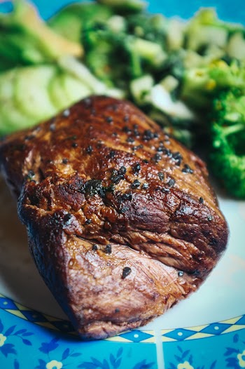 Beef steak with black salt close up 