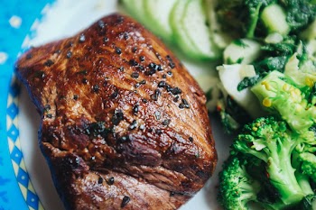 Beef steak with black salt close up 