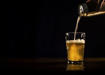 Beer Pouring From Can To Glass