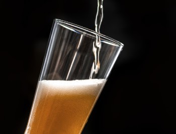 Beer Pouring Into Glass