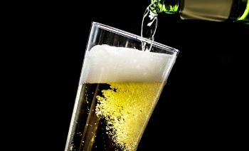 Beer Pouring Into Glass Cup