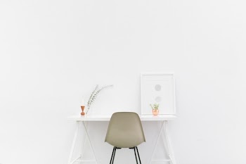 Beige and Black Chair in Front of White Desk