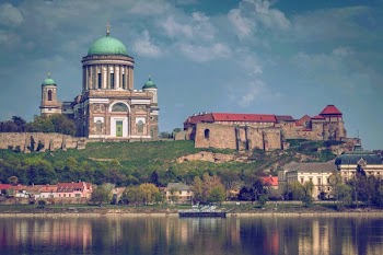 Beige and White Dome Building Near Body of Water